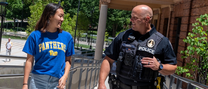 Pitt Student talking with Pitt Police officer
