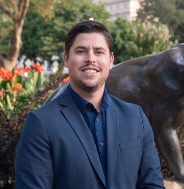 Ryan Young in front of Pitt Panther statue